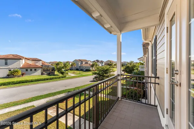 an aerial view of residential building and lake