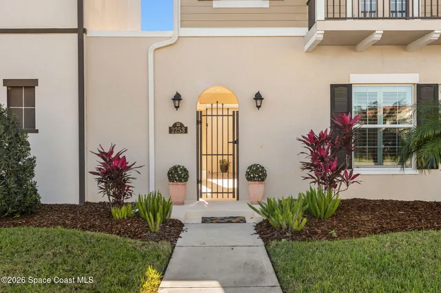 a potted plant sitting in front of a door