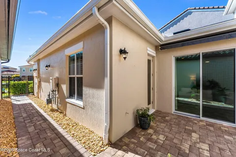 an aerial view of a house with a swimming pool