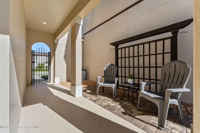 a view of a swimming pool with chairs