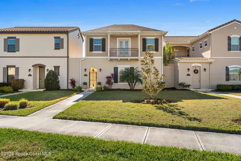 an aerial view of residential building and lake