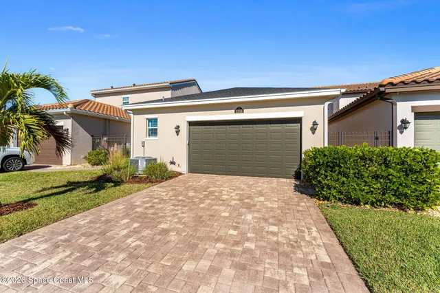 an aerial view of a swimming pool and outdoor space