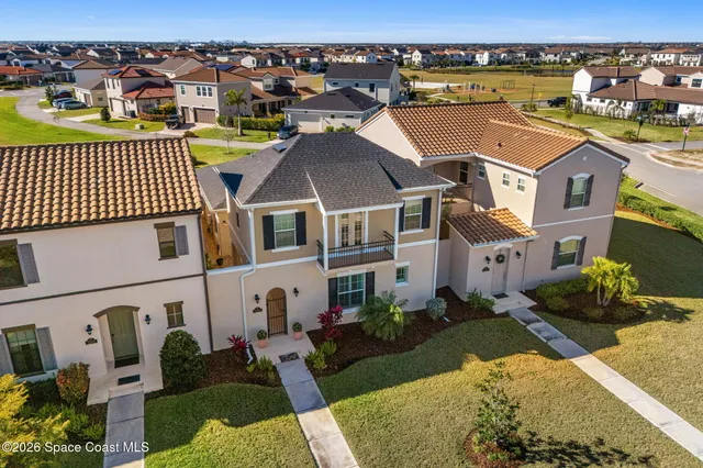 an aerial view of residential houses with outdoor space