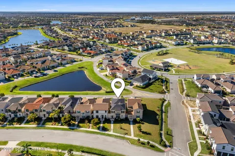 an aerial view of residential houses with outdoor space