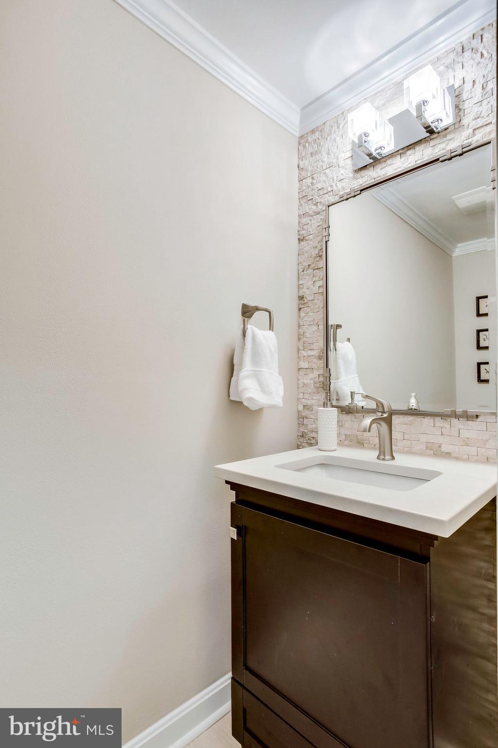 1536 Deer Point Way Reston, VA 20194 - Photo 19 of 53 Spa inspired tile accent wall in powder room