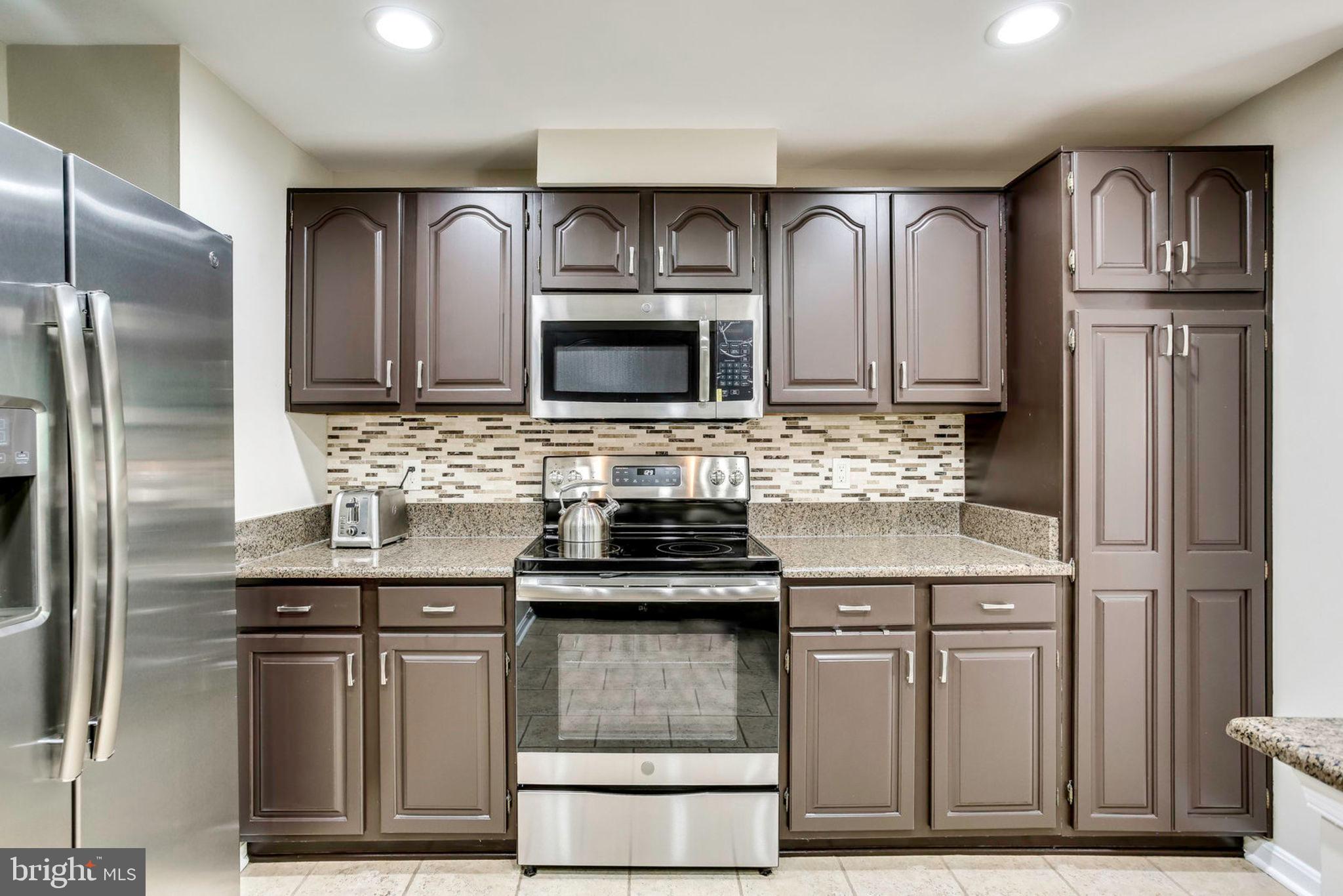 1536 Deer Point Way Reston, VA 20194 - Photo 8 of 53 Pantry cabinet and tile backsplash