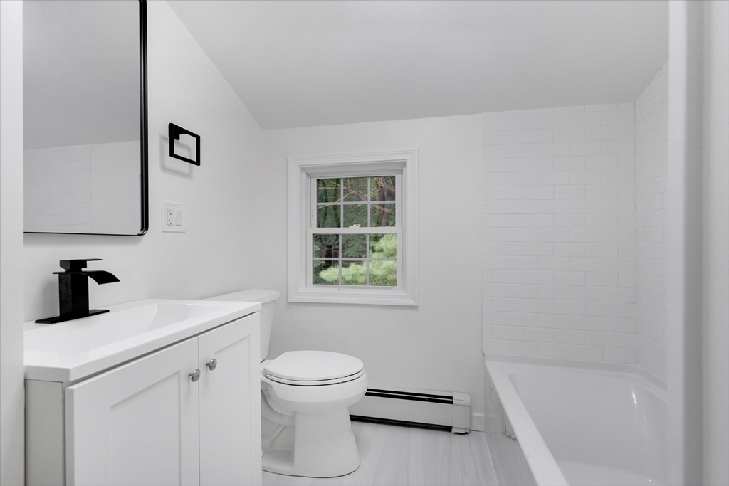 34 Carleton Road Hingham, MA 02043 - Photo 20 of 35 a bathroom with a sink a toilet and a bathtub