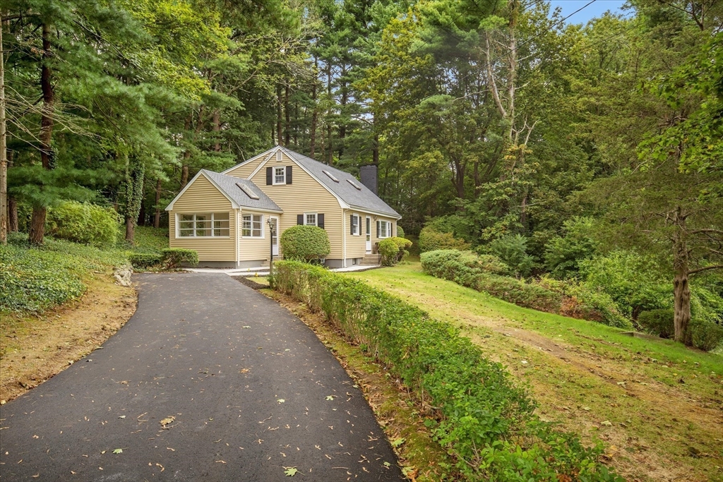34 Carleton Road Hingham, MA 02043 - Photo 2 of 35 a front view of a house with a yard and trees