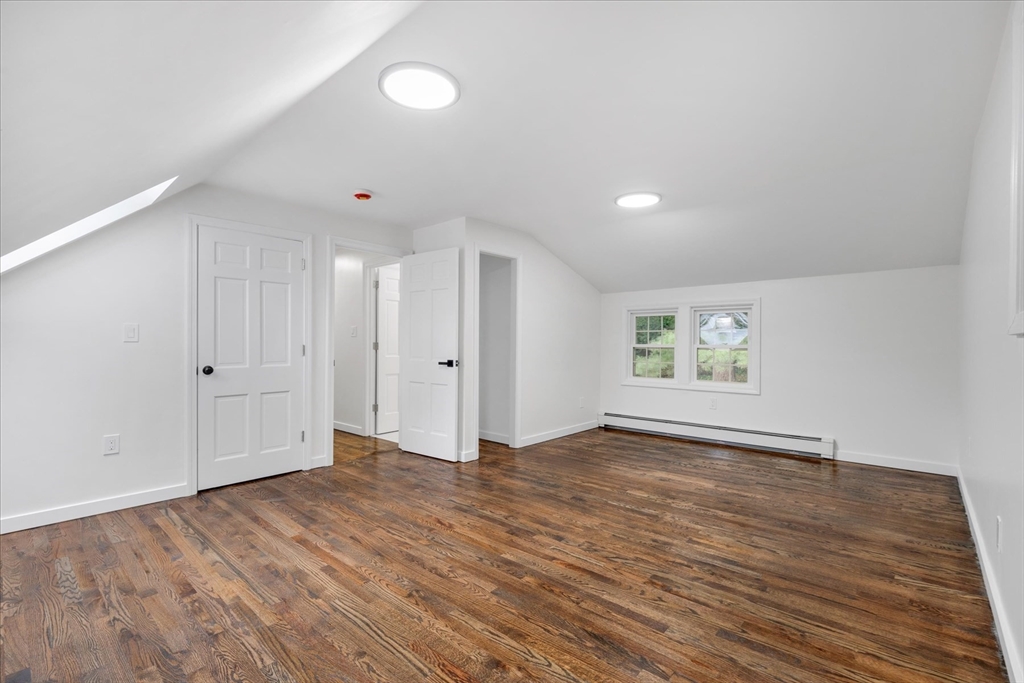 34 Carleton Road Hingham, MA 02043 - Photo 21 of 35 a view of an empty room with wooden floor and window