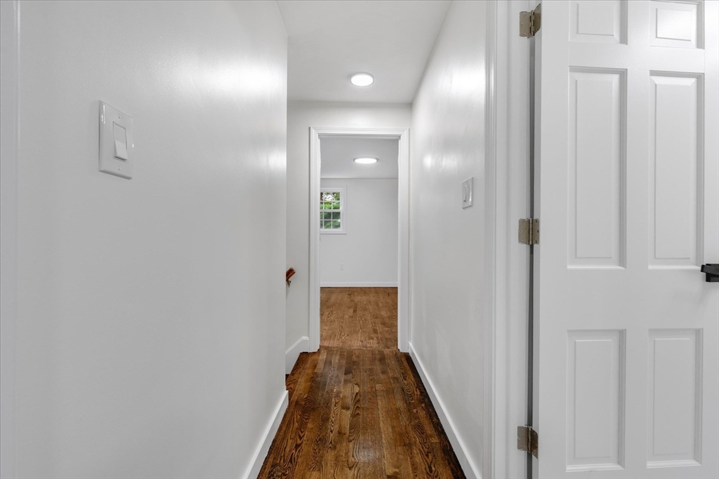 34 Carleton Road Hingham, MA 02043 - Photo 23 of 35 a view of a hallway with wooden floor