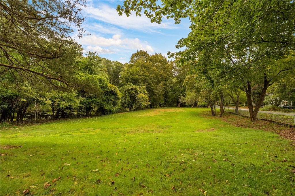 34 Carleton Road Hingham, MA 02043 - Photo 30 of 35 a view of a yard with a house