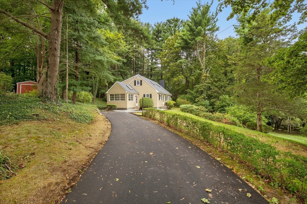 34 Carleton Road Hingham, MA 02043 - Photo 3 of 35 a view of a wooden house with a yard and large trees