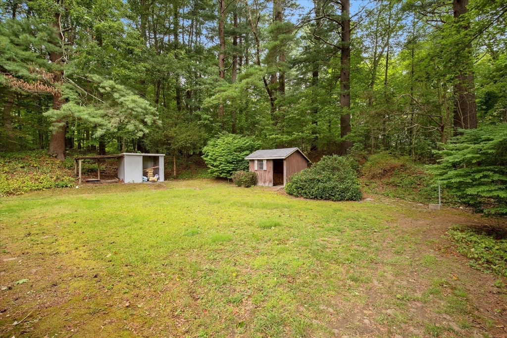34 Carleton Road Hingham, MA 02043 - Photo 4 of 35 a backyard of a house with table and chairs