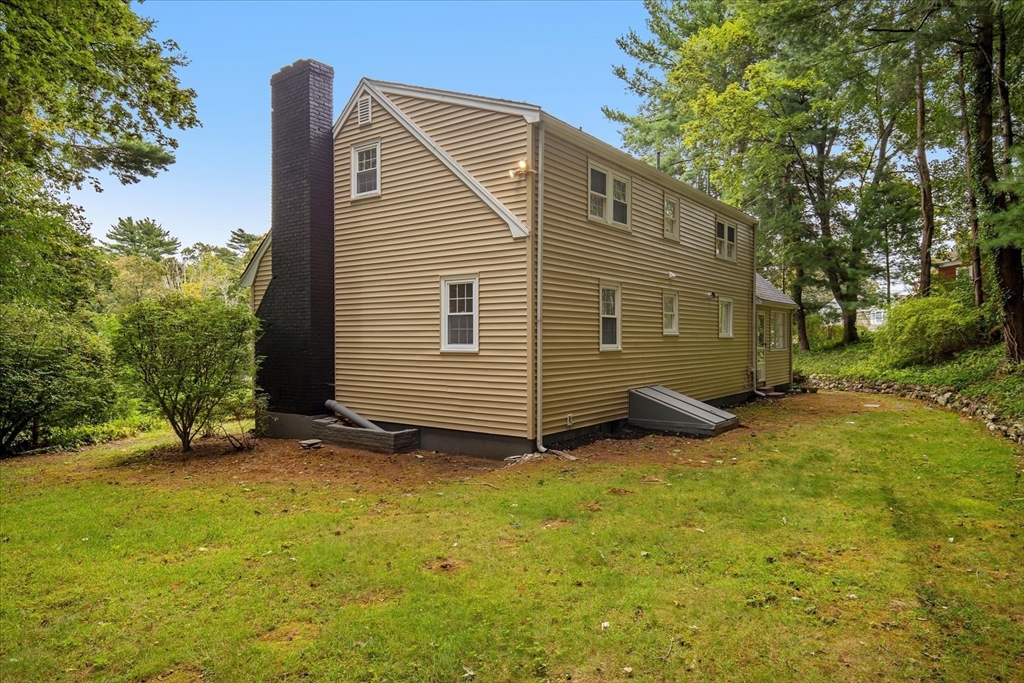 34 Carleton Road Hingham, MA 02043 - Photo 5 of 35 a view of a house with backyard and trees