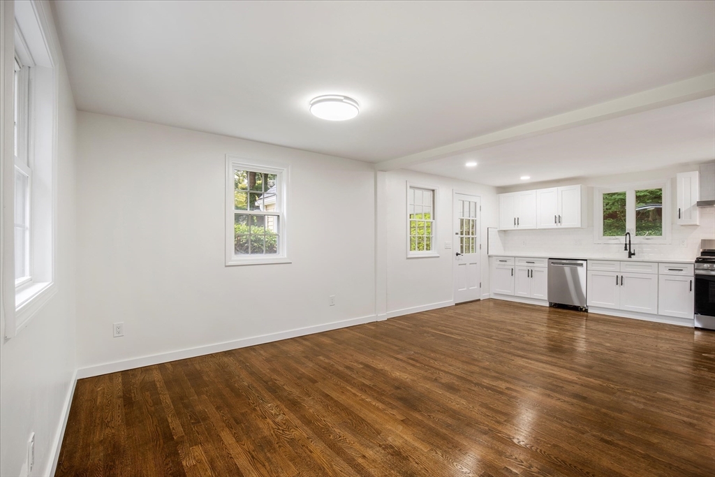 34 Carleton Road Hingham, MA 02043 - Photo 10 of 35 a view of an empty room with wooden floor and a window