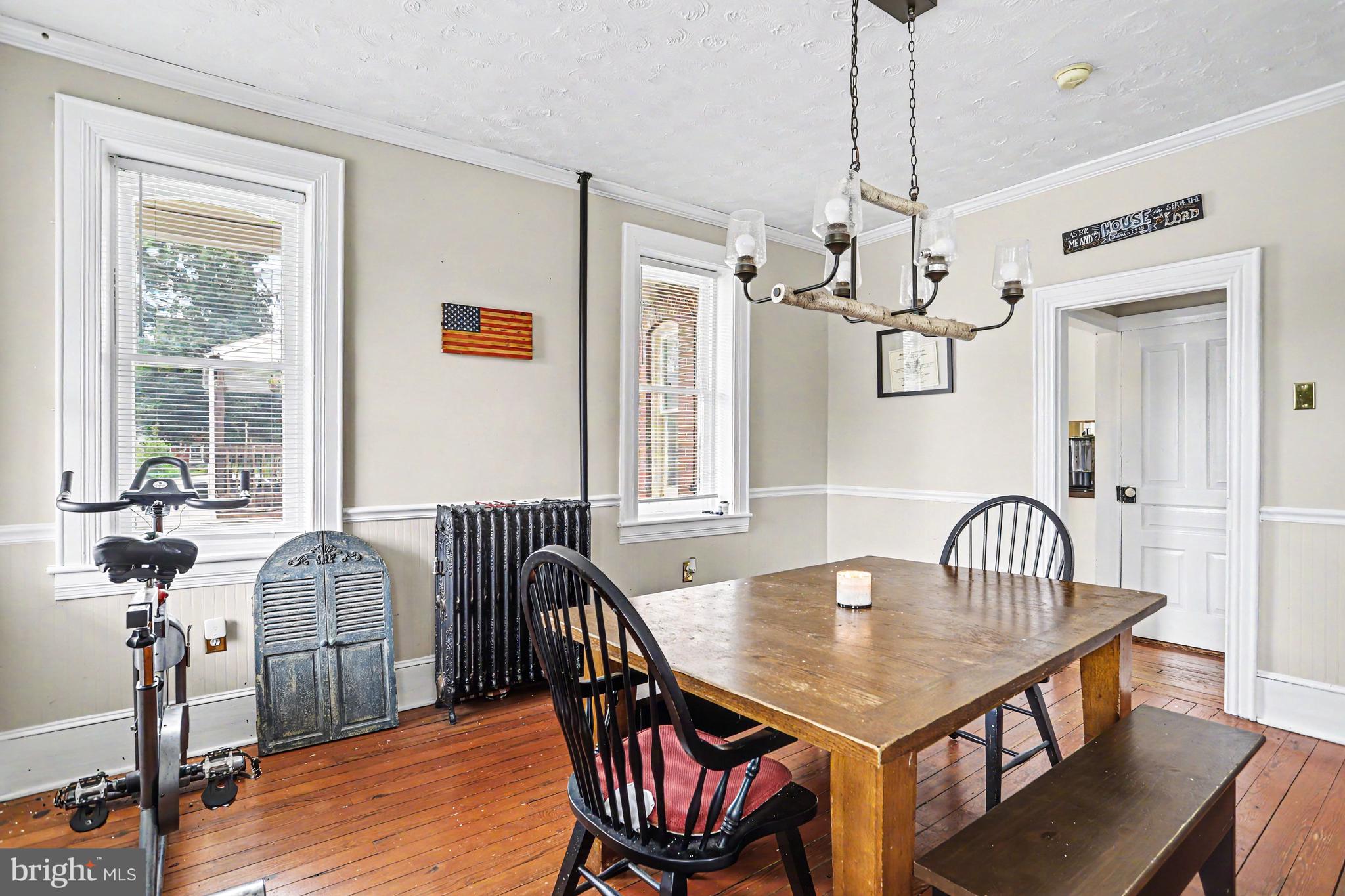 23 West George Street Yoe, PA 17313 - Photo 12 of 36 a dining room with furniture a chandelier and wooden floor