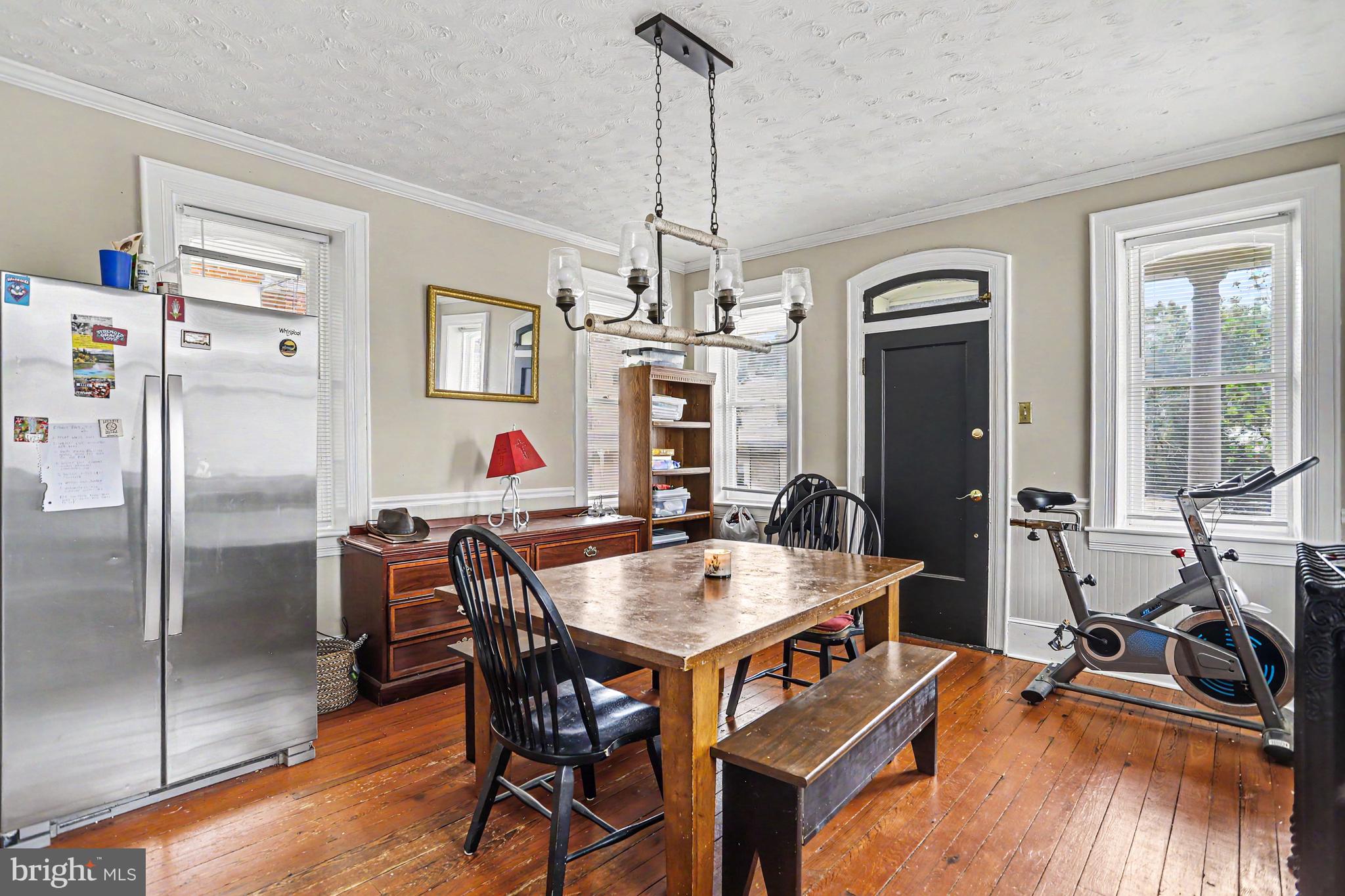 23 West George Street Yoe, PA 17313 - Photo 13 of 36 a dining room with furniture a chandelier and wooden floor