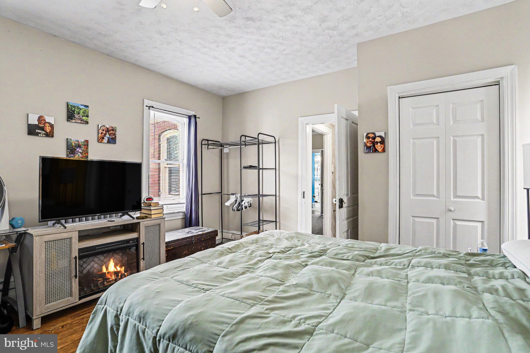 23 West George Street Yoe, PA 17313 - Photo 15 of 36 a bedroom with a bed and a flat screen tv