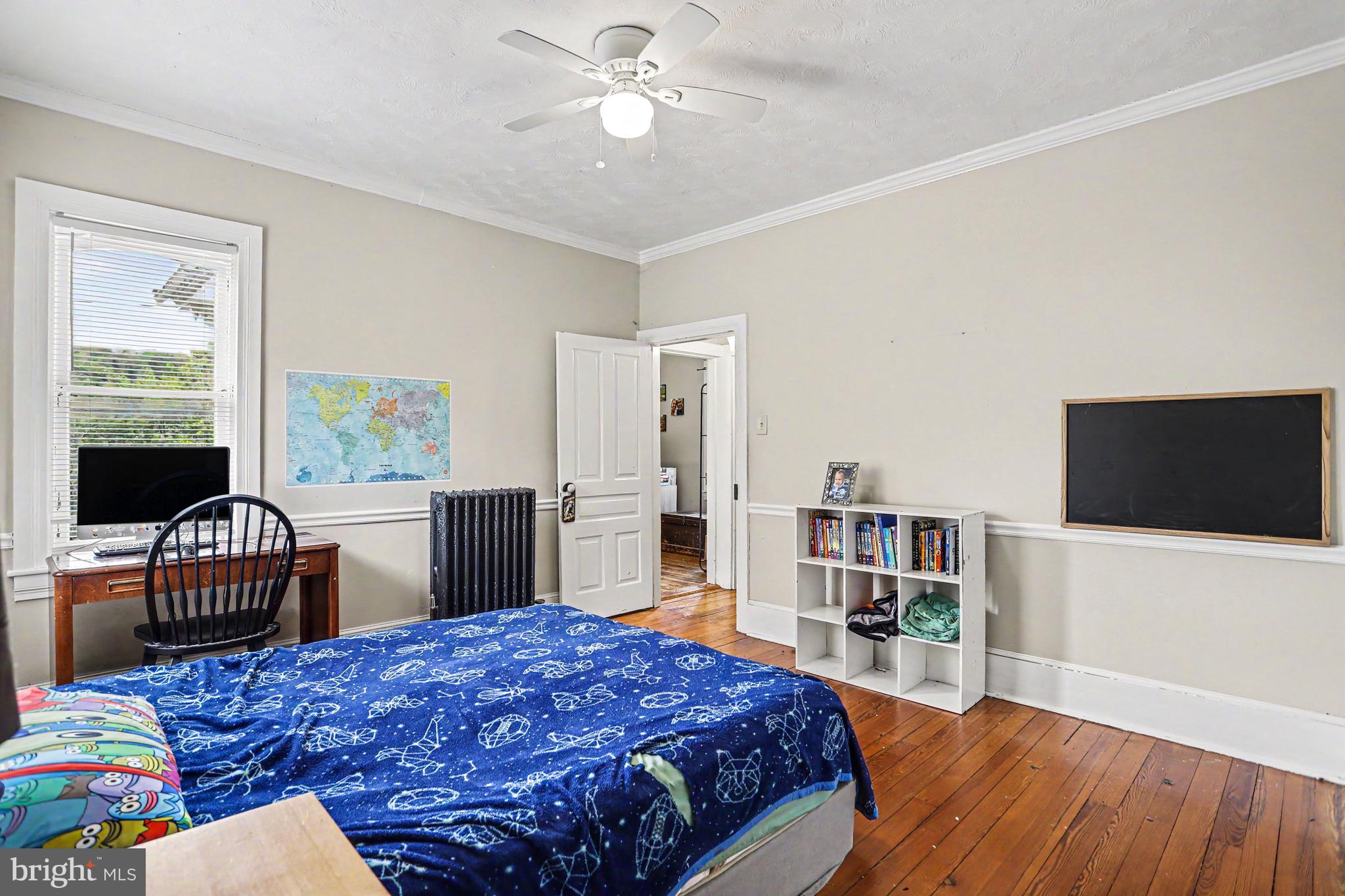 23 West George Street Yoe, PA 17313 - Photo 17 of 36 a bedroom with a bed and a flat screen tv