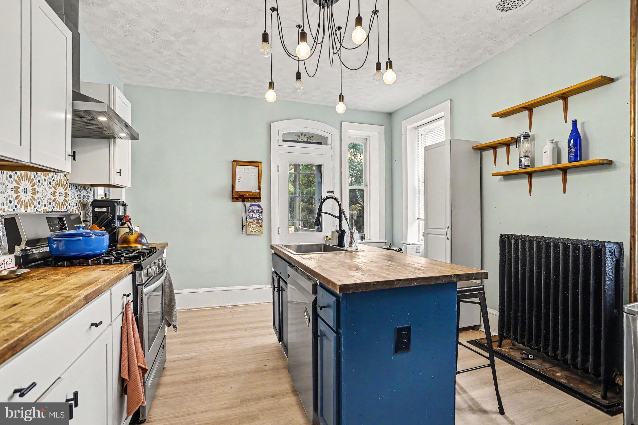 23 West George Street Yoe, PA 17313 - Photo 7 of 36 a kitchen that has a stove and a table