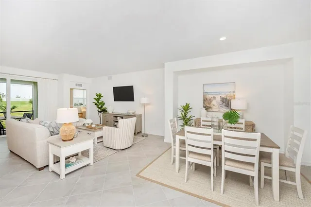 a spacious bedroom with a bed and a large window