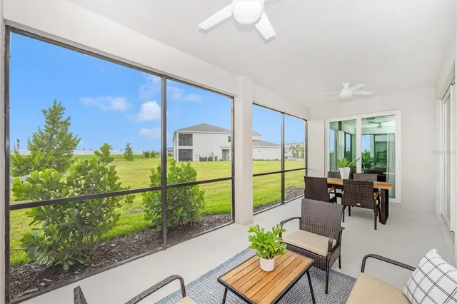 a view of a golf course with an ocean