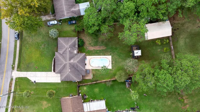 an aerial view of a house with a garden