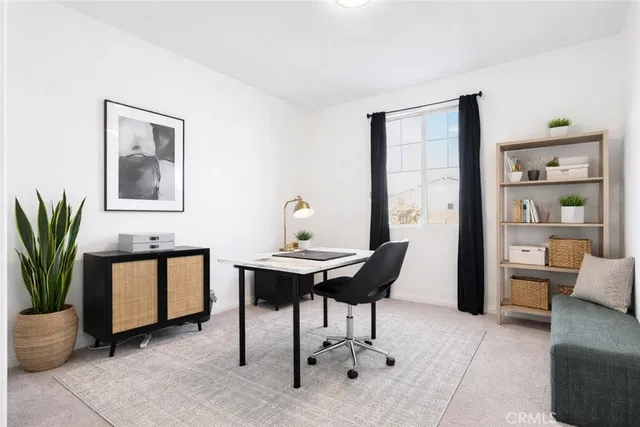 a view of a livingroom with furniture and window