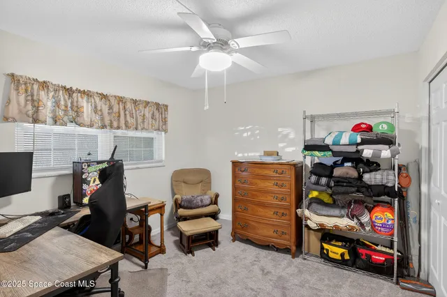 a view of a livingroom with furniture and entryway