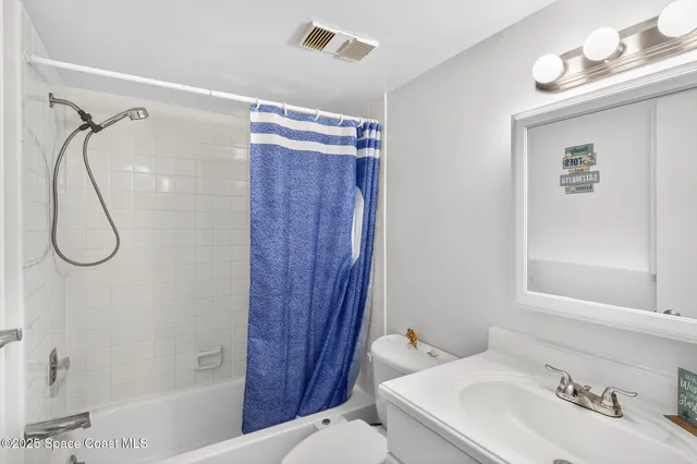a bathroom with a sink and a shower
