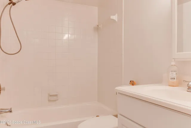 a view of a living room and floor to ceiling window