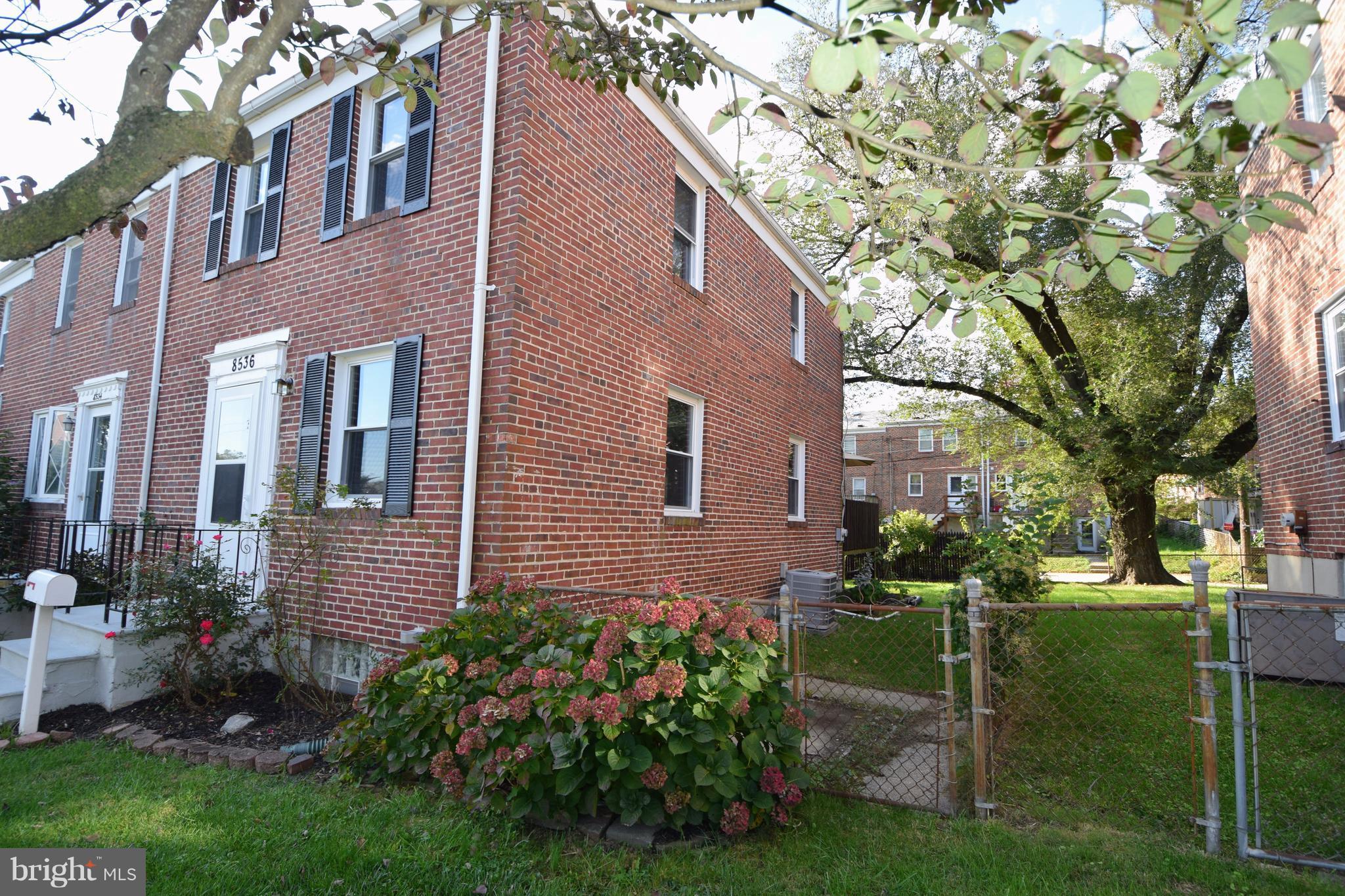 8536 Water Oak Road Baltimore, MD 21234 - Photo 2 of 27 a brick building with a yard