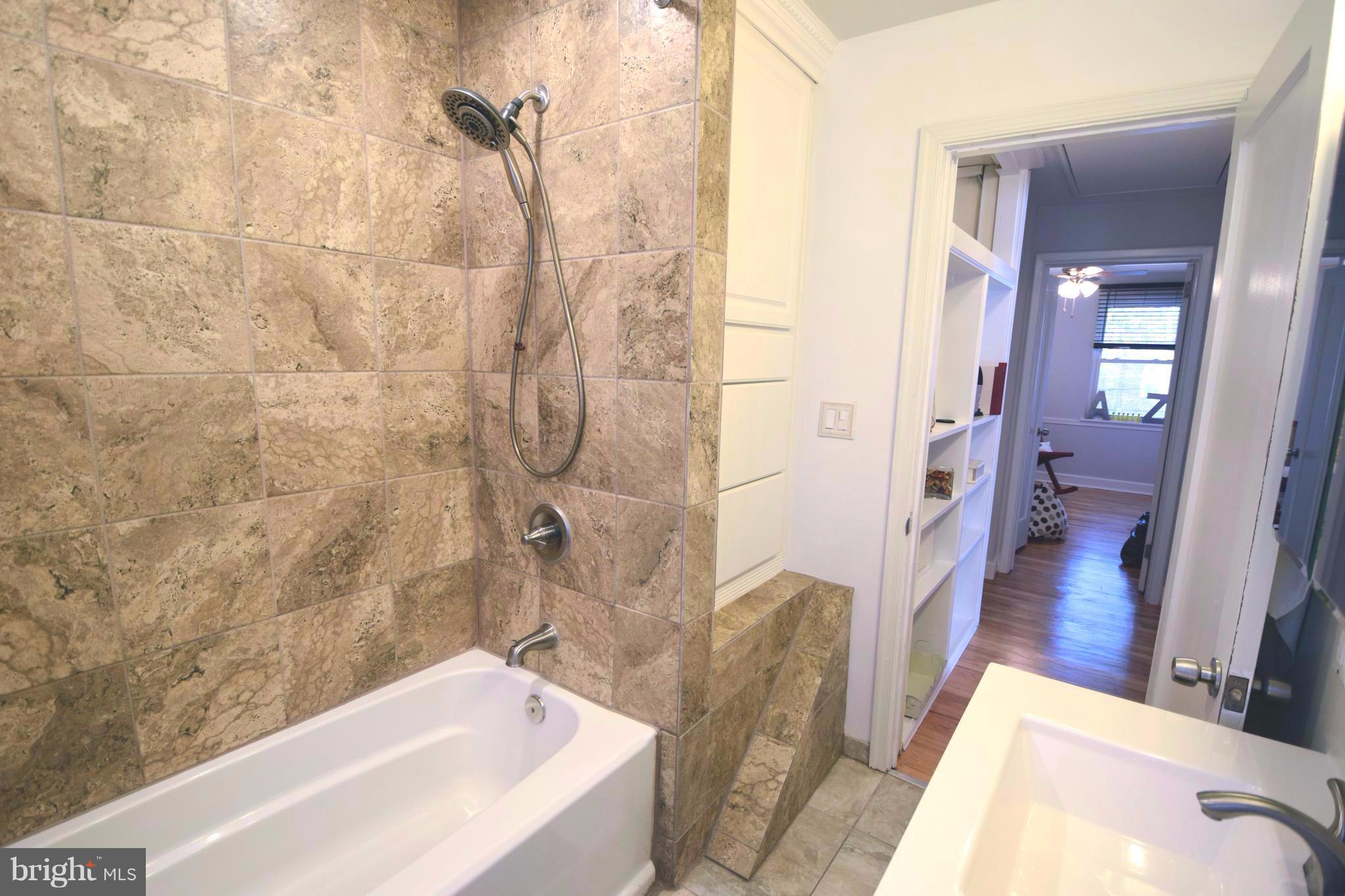 8536 Water Oak Road Baltimore, MD 21234 - Photo 15 of 27 a bathroom with a tub sink and shower