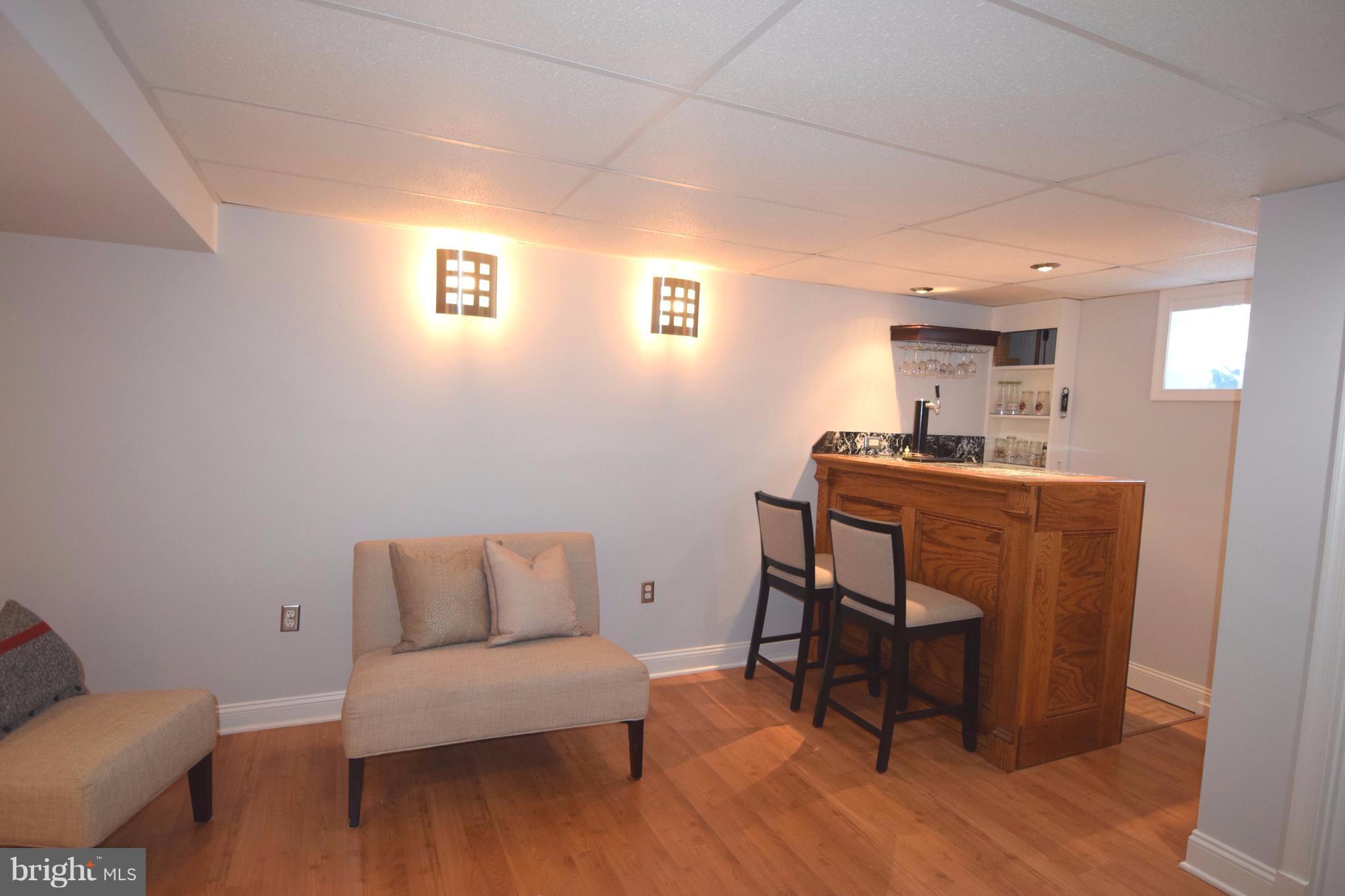 8536 Water Oak Road Baltimore, MD 21234 - Photo 22 of 27 a living room with a couch and a table