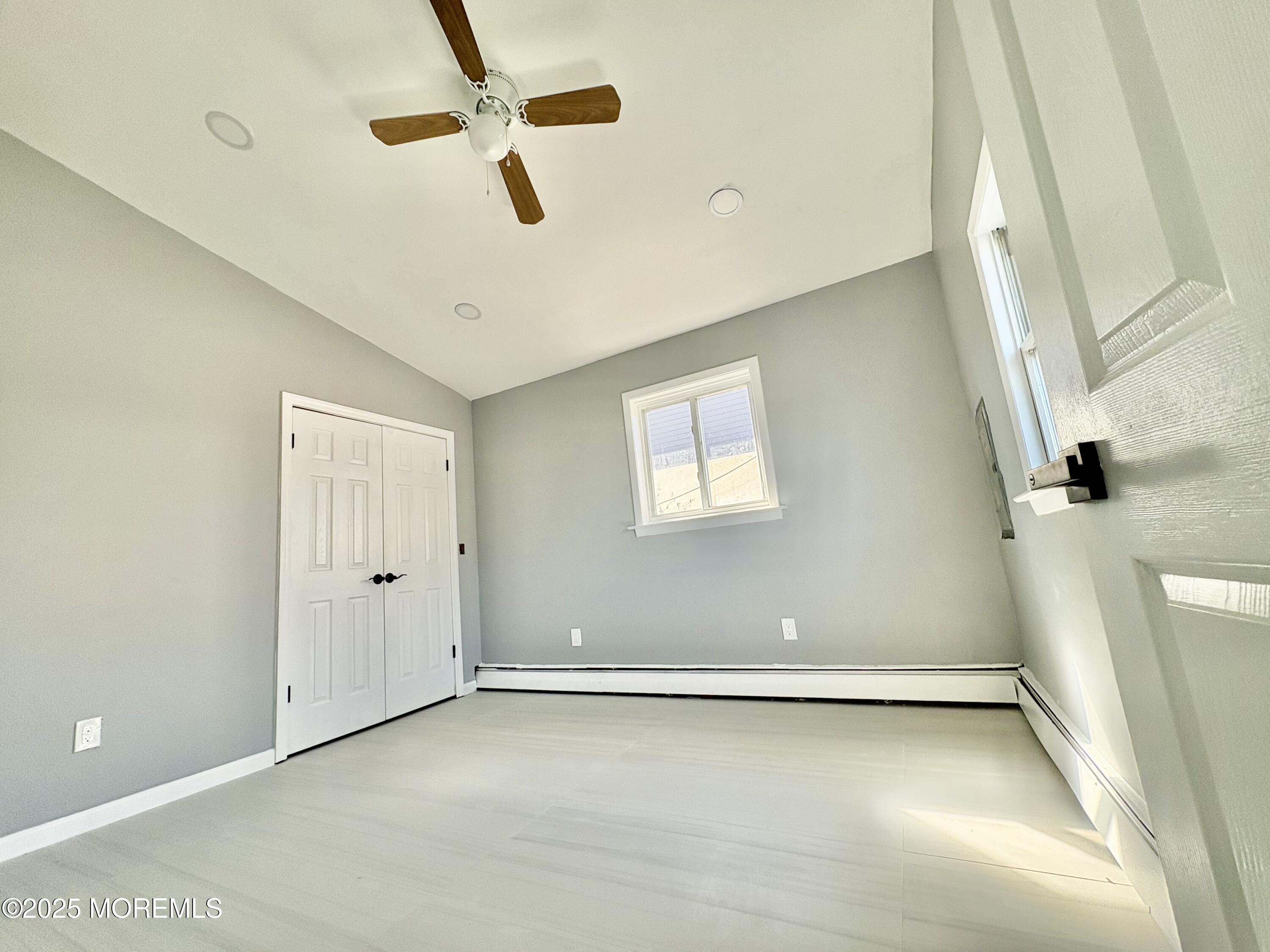 1712 Binnacle Road Forked River, NJ 08731 - Photo 3 of 9 a view of a room with a ceiling fan and window