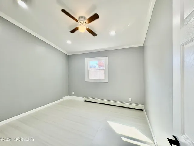 a large white kitchen with stainless steel appliances granite countertop a refrigerator and a stove top oven