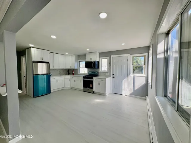 a view of empty room with stairs