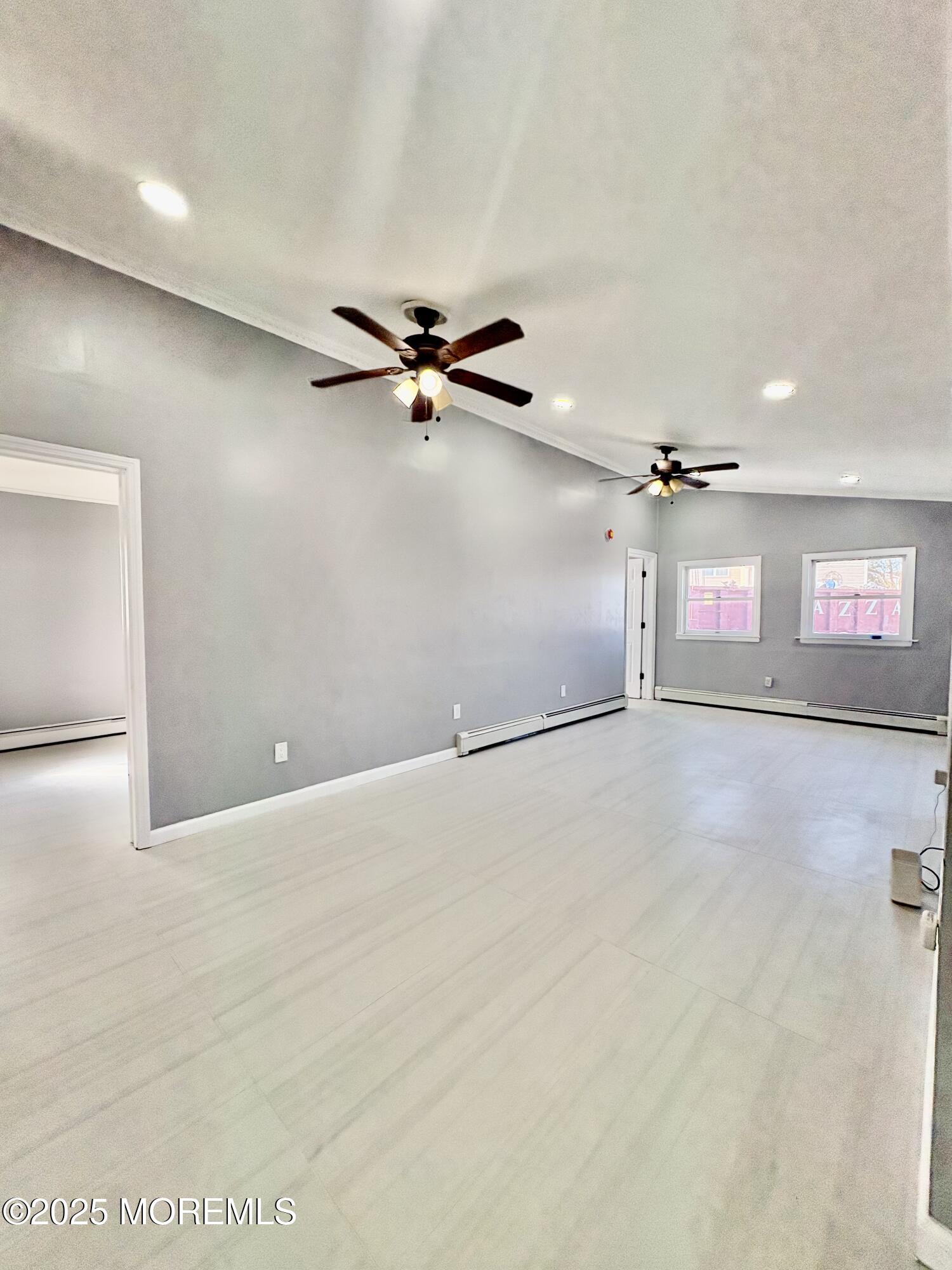 1712 Binnacle Road Forked River, NJ 08731 - Photo 8 of 9 a view of a livingroom with a ceiling fan