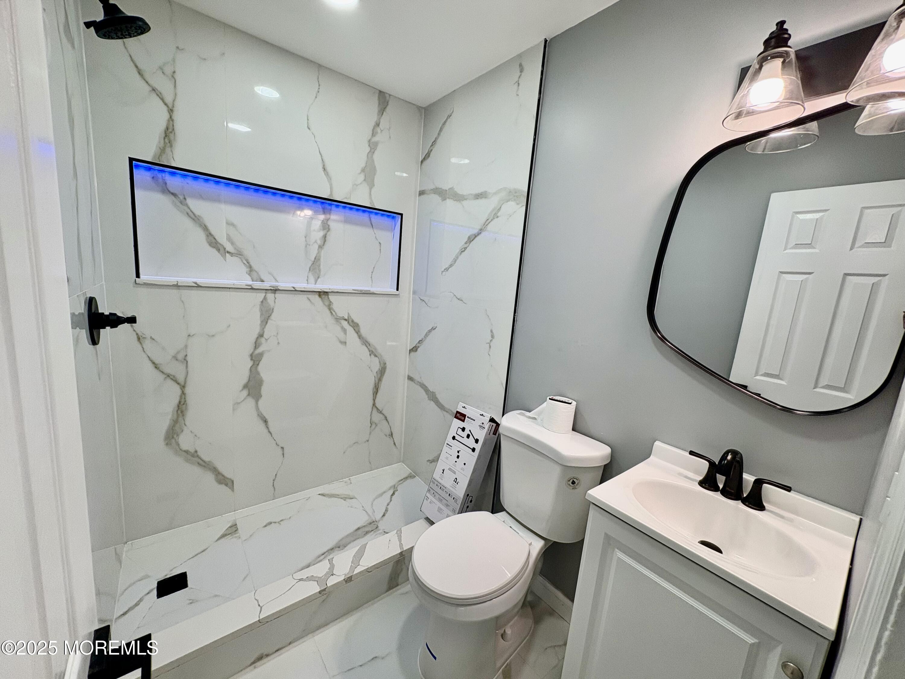 1712 Binnacle Road Forked River, NJ 08731 - Photo 9 of 9 a bathroom with a sink toilet and shower