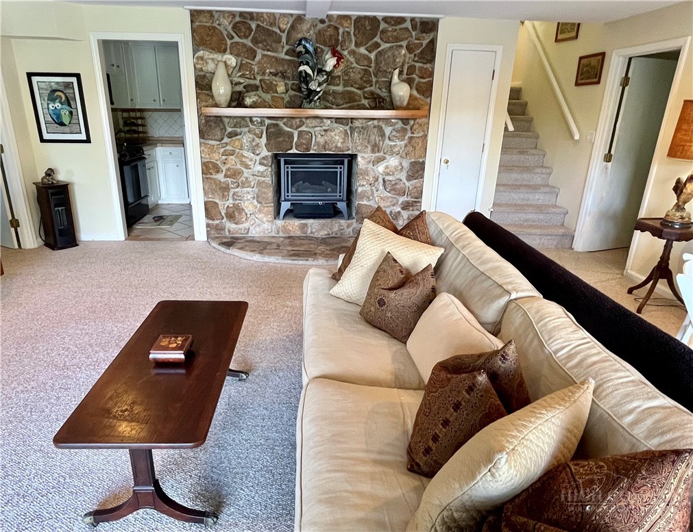638 Ridge Road Glade Valley, NC 28627 - Photo 23 of 44 a living room with furniture and a fireplace