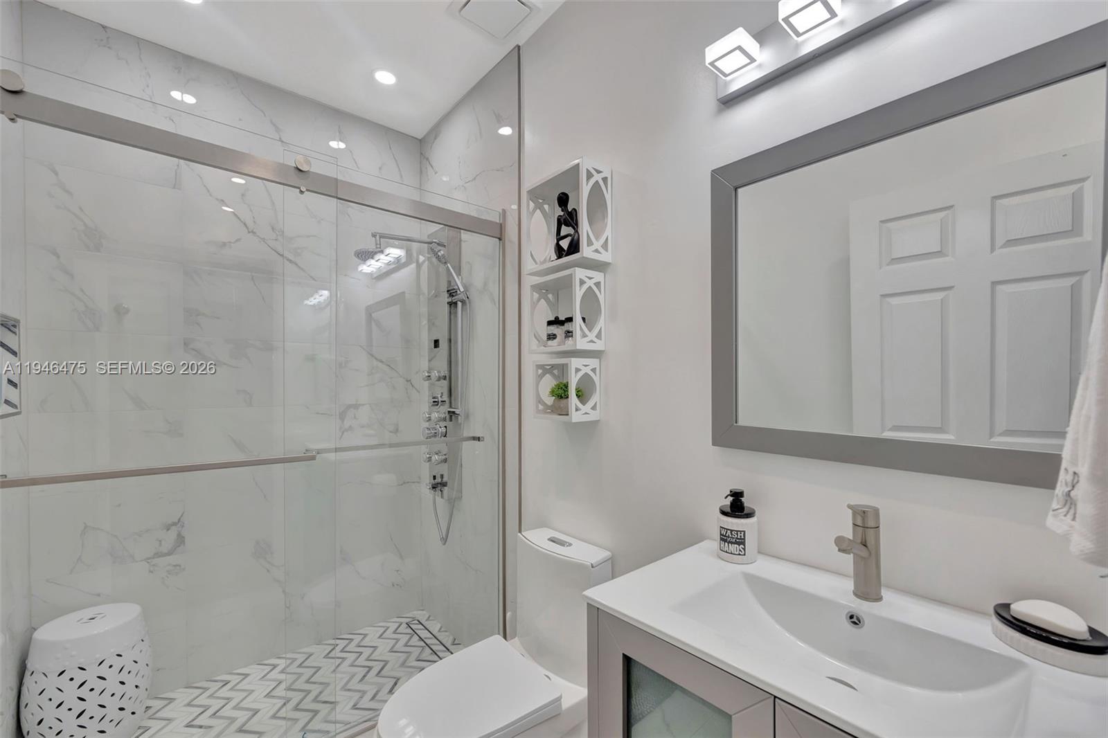 11227 Southwest 230th Terrace, Unit 11227 Miami, FL 33170 - Photo 24 of 37 a bathroom with a sink toilet and shower