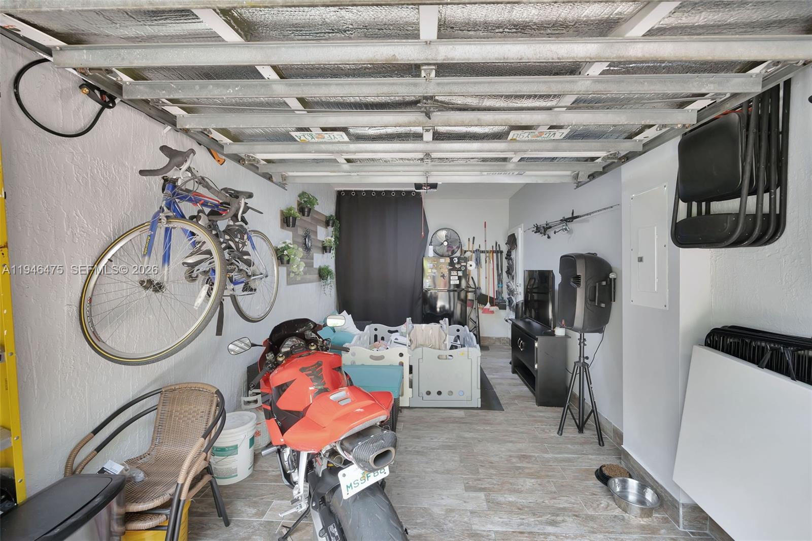 11227 Southwest 230th Terrace, Unit 11227 Miami, FL 33170 - Photo 37 of 37 a view of a room with gym equipment