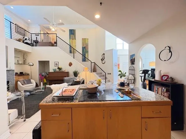 a living room with fireplace furniture and a chandelier