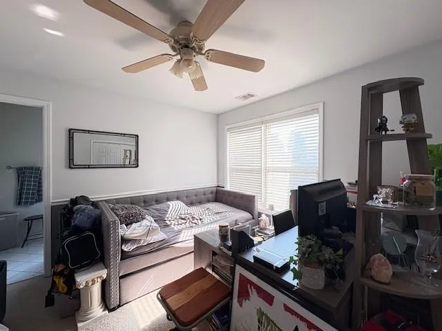 a living room with furniture and a window