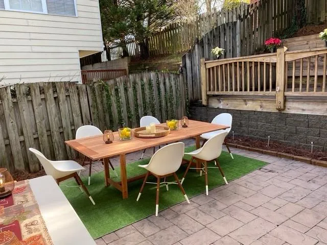 a view of a patio with a table chairs and a patio