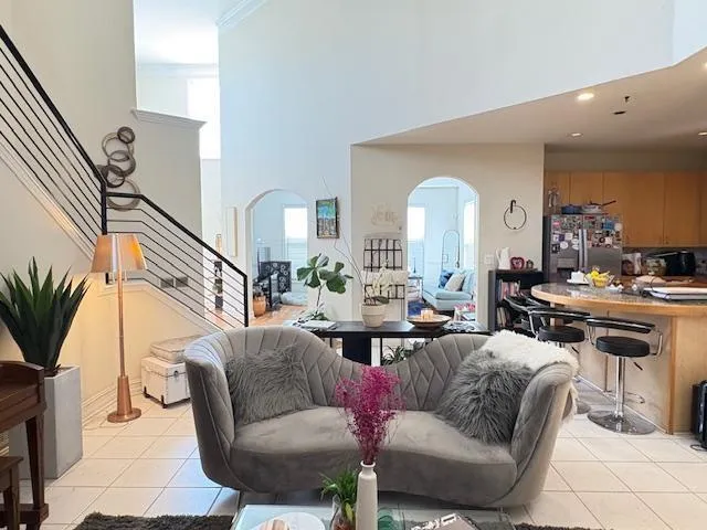 a living room with furniture fireplace and a large mirror