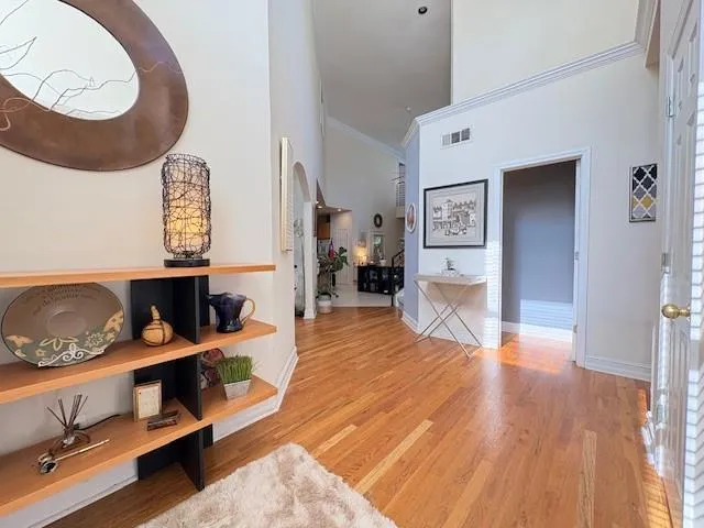 a view of living room with furniture and wooden floor