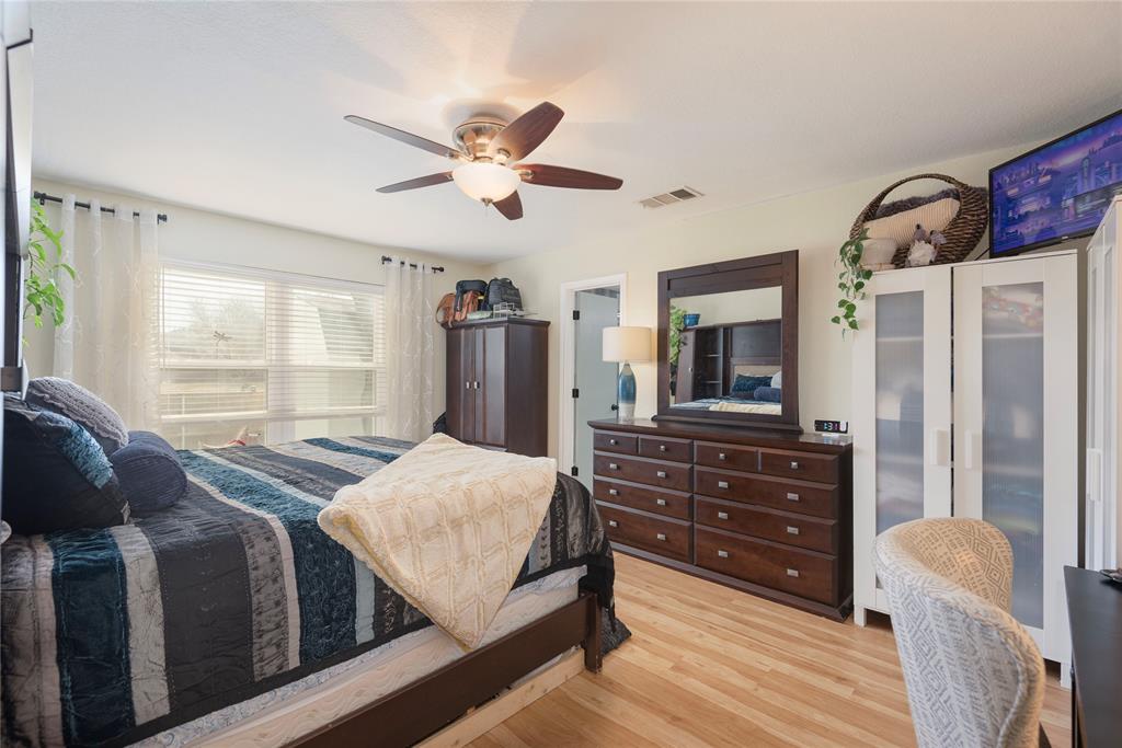 7613 Dockside Drive Rowlett, TX 75088 - Photo 11 of 40 a bedroom with a bed a window and dresser