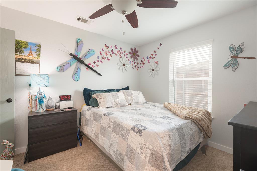 7613 Dockside Drive Rowlett, TX 75088 - Photo 14 of 40 a bedroom with bed and window