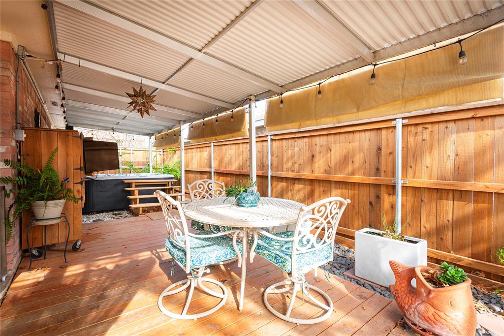7613 Dockside Drive Rowlett, TX 75088 - Photo 19 of 40 a view of a patio with table and chairs and potted plants